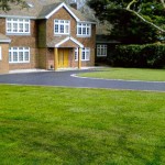 clean tarmac driveway green glass